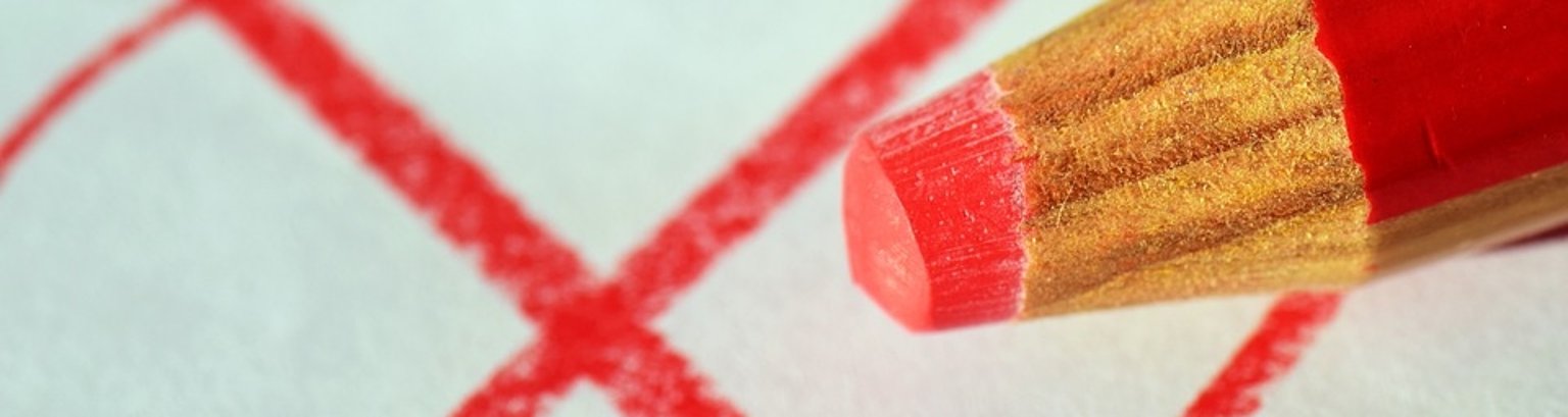 Wahlen Ein roter Stift malt einen rotes x.